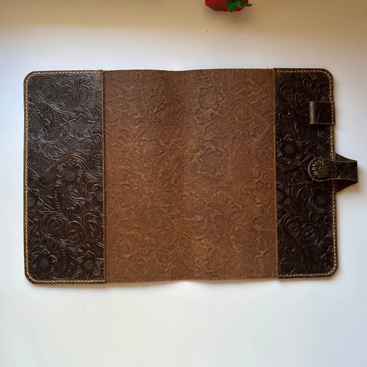 Vintage leather Bible cover with floral embossing and snap button