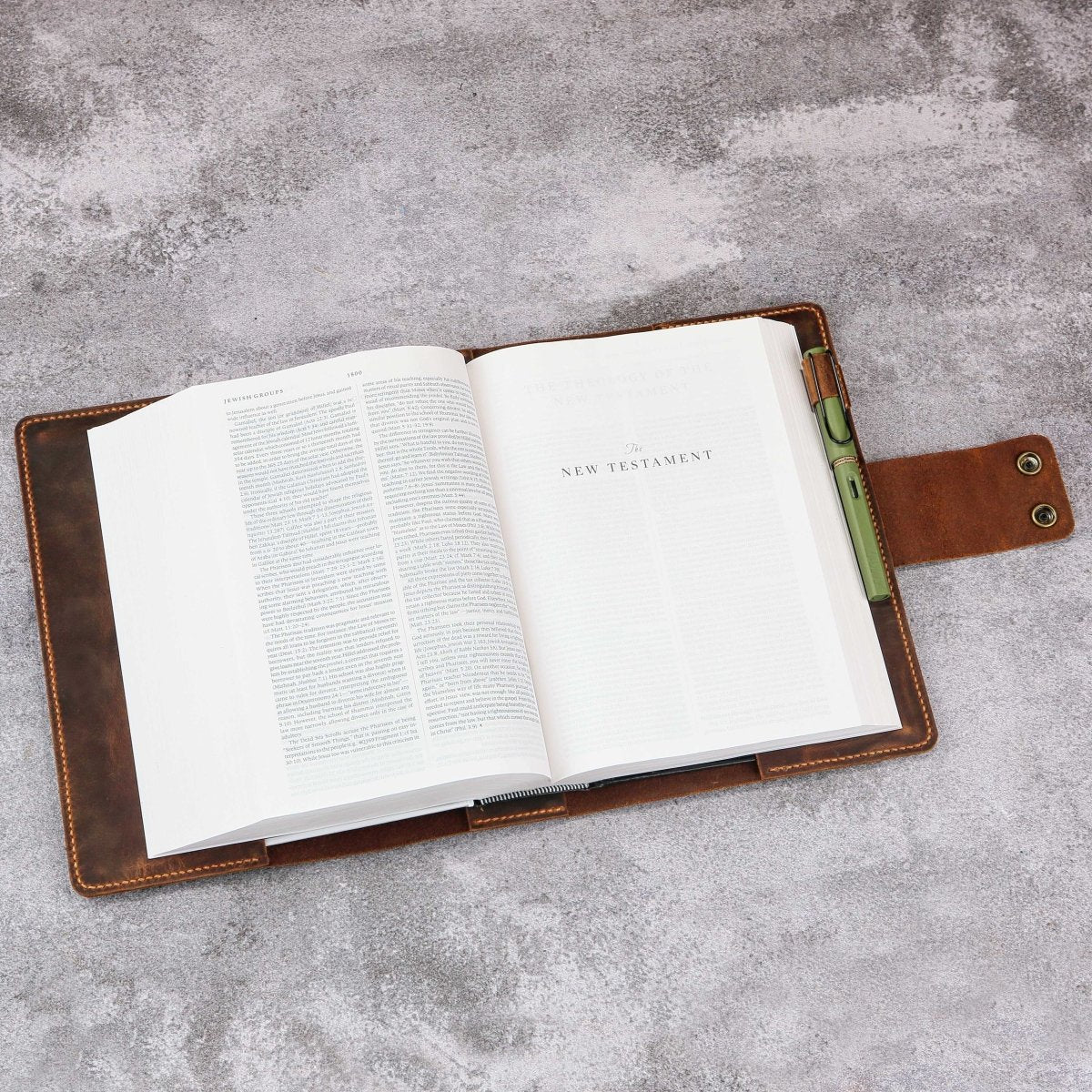 Button clasp closure on vintage leather Bible cover