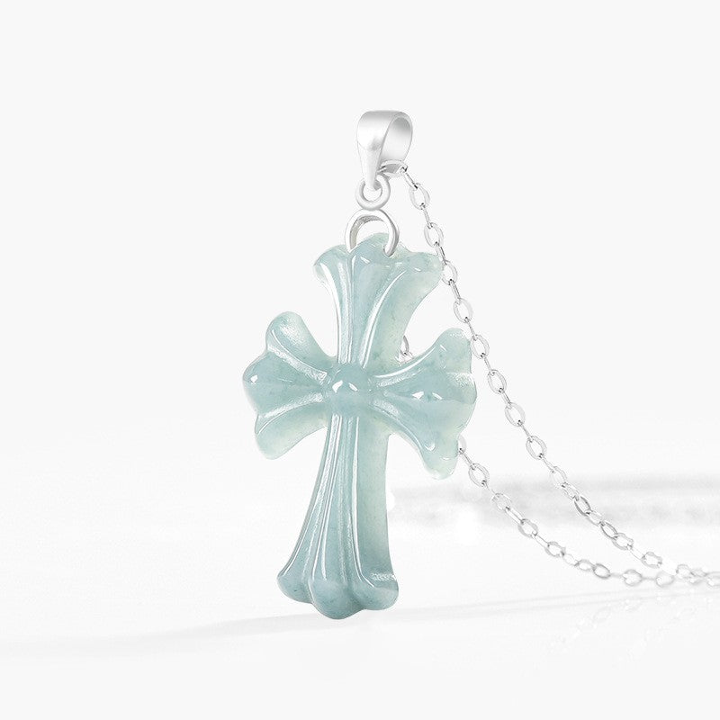Detailed view of a natural blue water jadeite cross pendant
