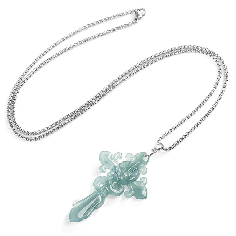 Blue water jadeite serpent cross pendant with a decorative pendant on a white background
