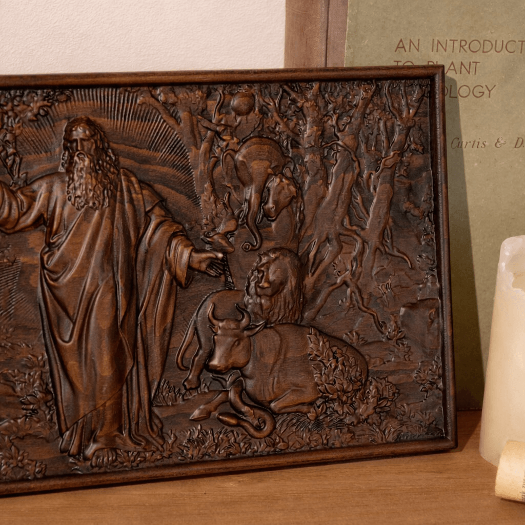 Beechwood Garden of Eden biblical relief plaque displayed on a wooden shelf in a home setting