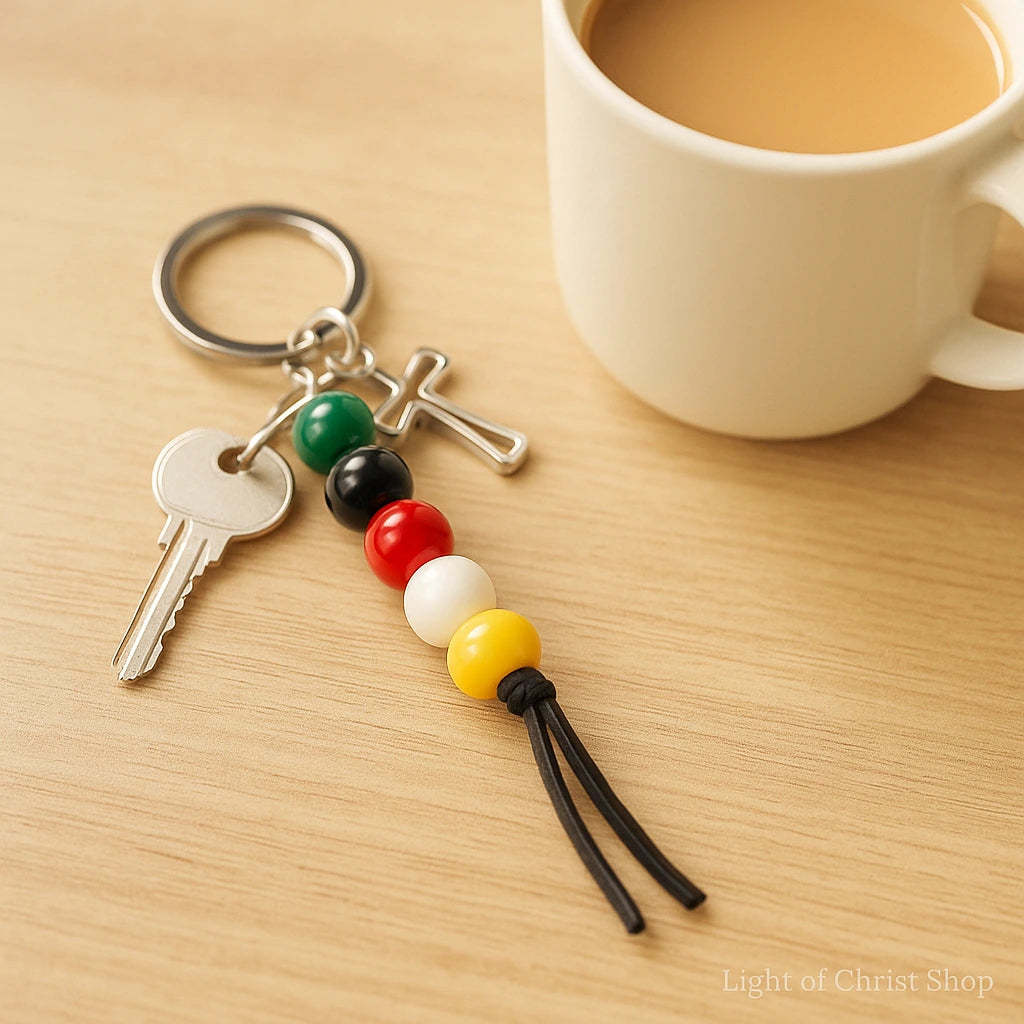 Gospel Beads Keychain on everyday keys, lifestyle shot near a wood table and coffee mug.