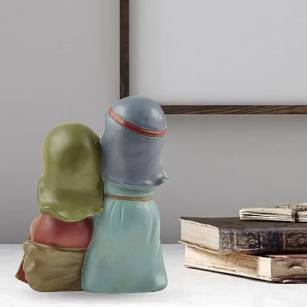 Back view of the Holy Family Nativity figurine, showing the resin design of Mary and Joseph from behind