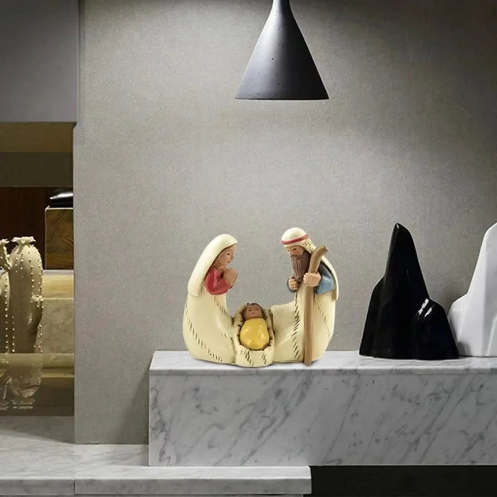 Holy Family Nativity figurine in Style B displayed on a marble shelf, featuring Mary, Joseph, and Baby Jesus in a resin manger scene