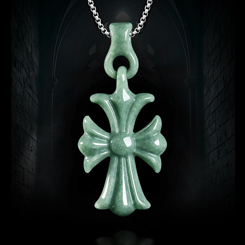 Natural Grade A bean green jadeite cross pendant on a silver chain against a dark Gothic background