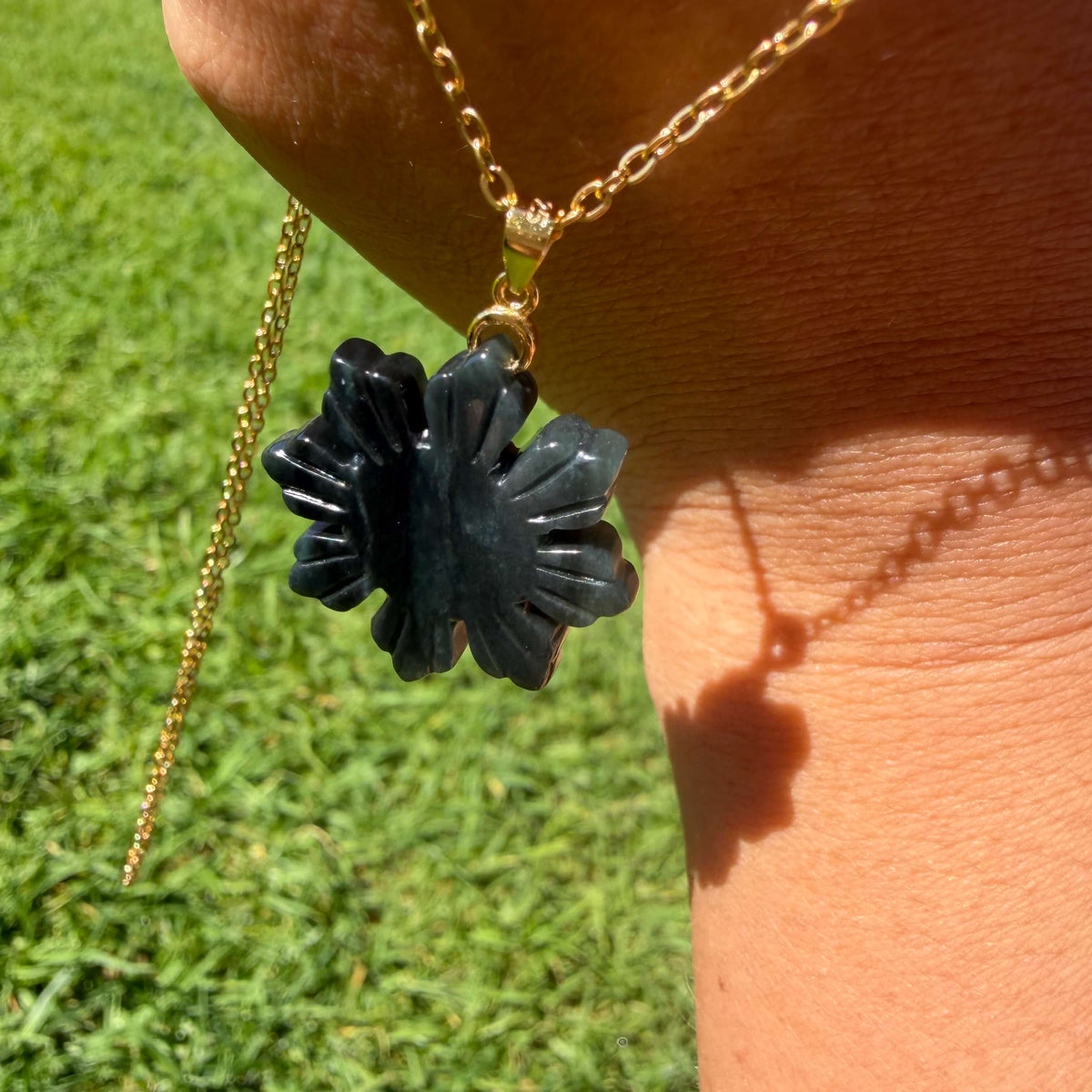 Natural untreated Wuji jadeite Filipino Sunflower pendant photographed outdoors in natural light
