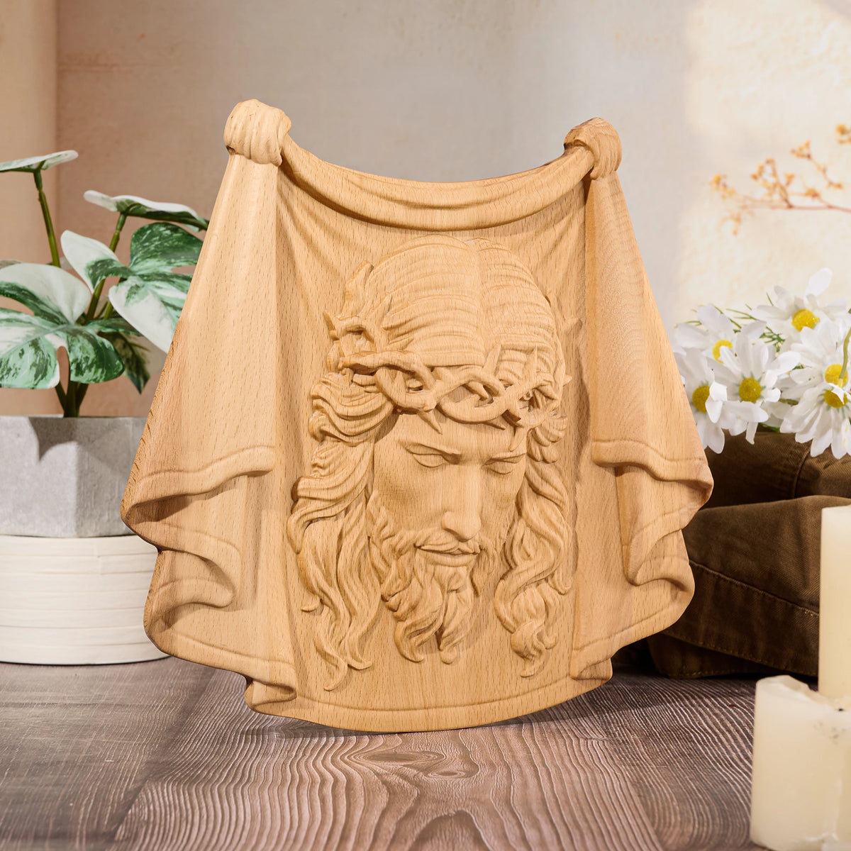 Natural wood Jesus relief carving with crown of thorns and detailed robe folds