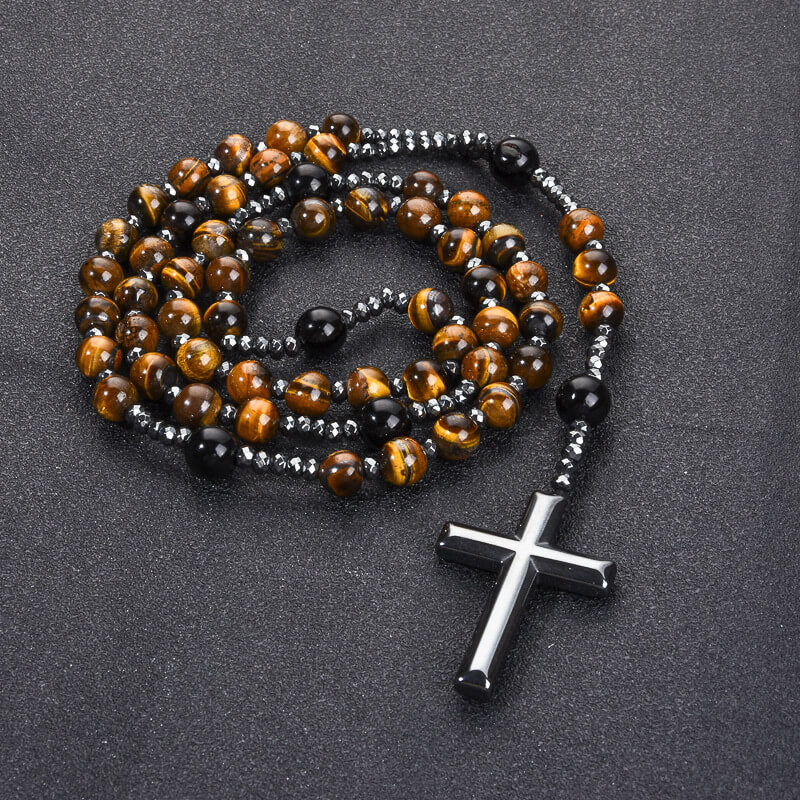 Natural Tiger's Eye rosary necklace with Hematite cross displayed on a dark background