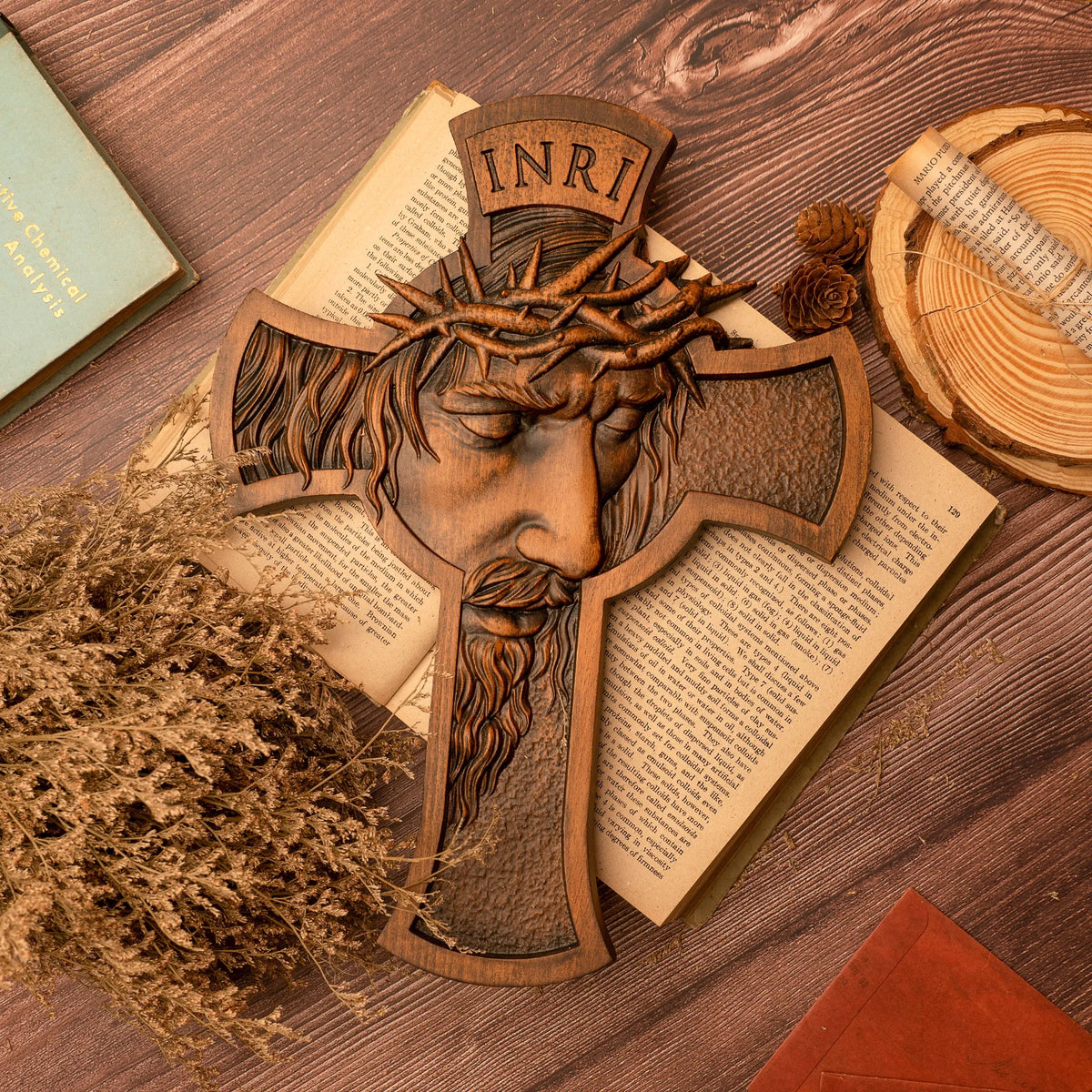 Wooden Jesus crucifix with detailed carving displayed on an open Bible and natural wood surface